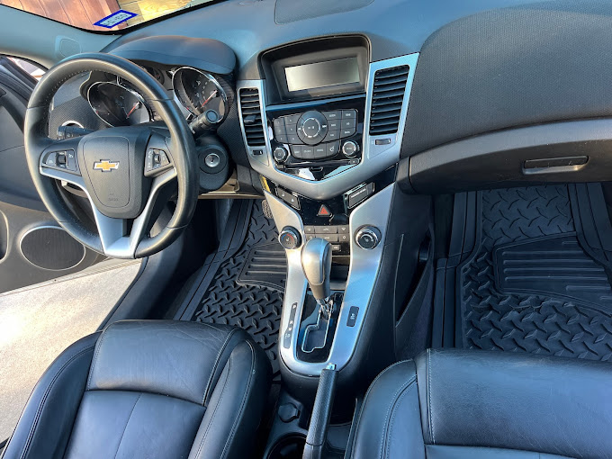 The interior of a car with blue leather seats