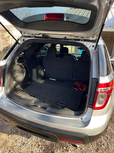 The back of a car with its trunk open